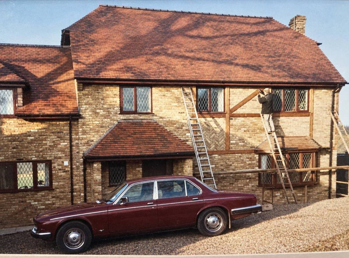 A house under construction in the late 1980s with the decorative timber work being fitted